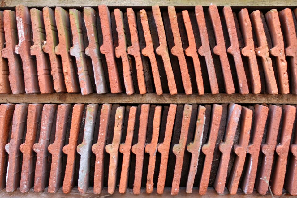 Roof tiles background the regularity of the