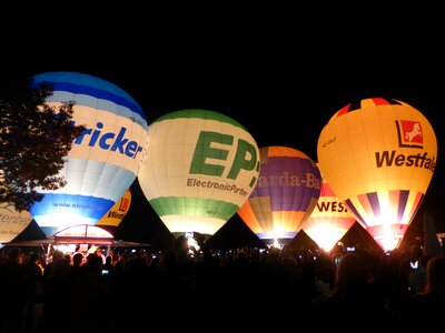 Hot air balloons glow night photo