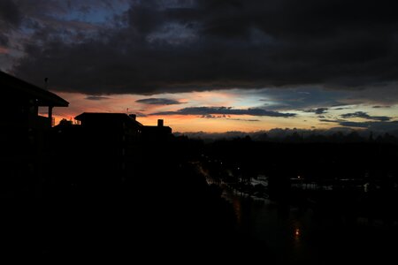 Sunset dark clouds reflection photo