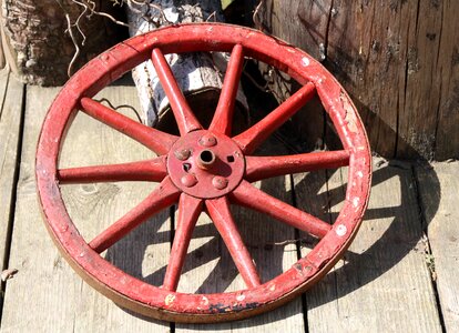 Red wooden wheel decoration photo