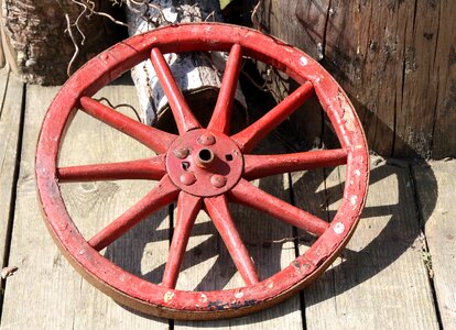 Red wooden wheel decoration