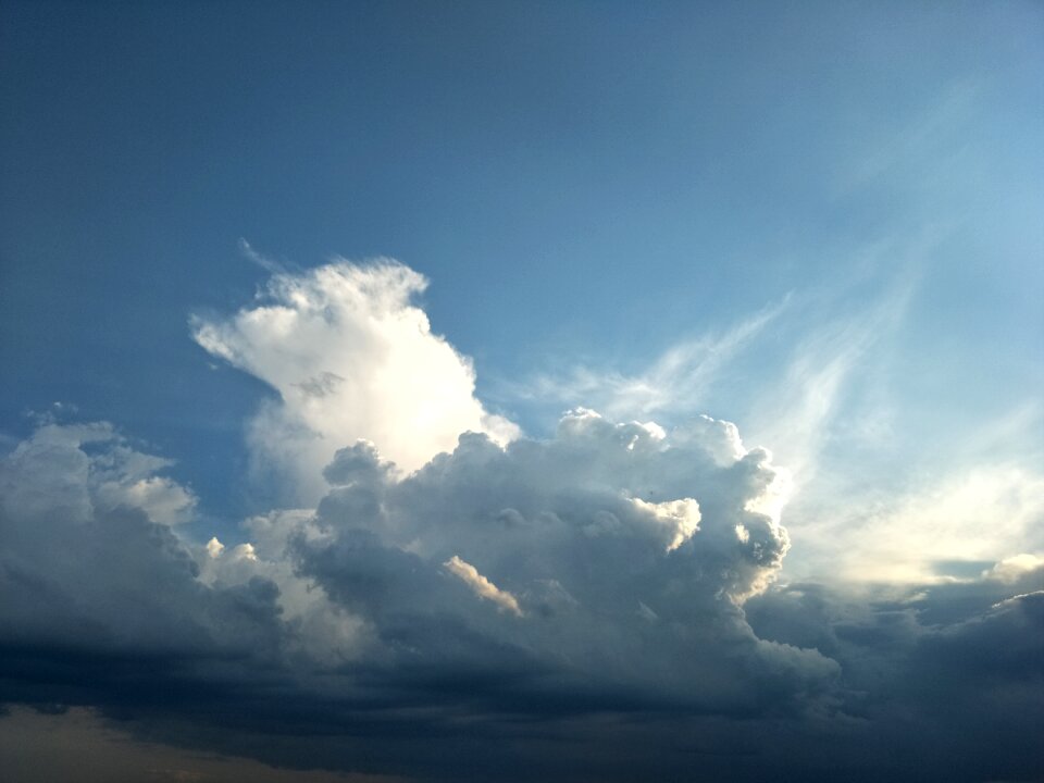 Dark clouds blue sky wind
