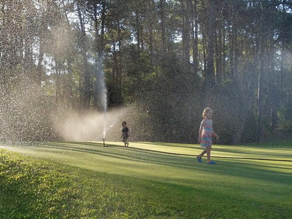 Sprinklers playing golf