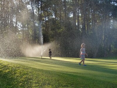 Sprinklers playing golf