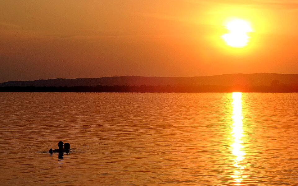 Sunset water bathers