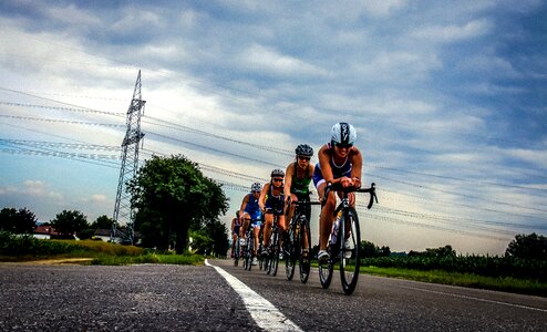 Triathlete cyclists landscape