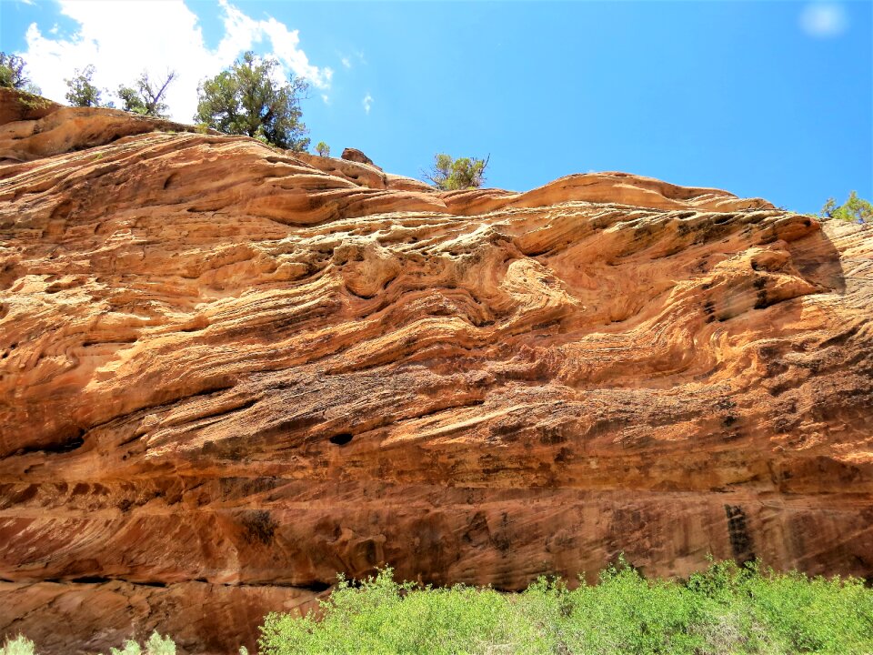 Unusual rock strata blue sky