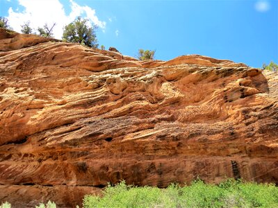 Unusual rock strata blue sky photo