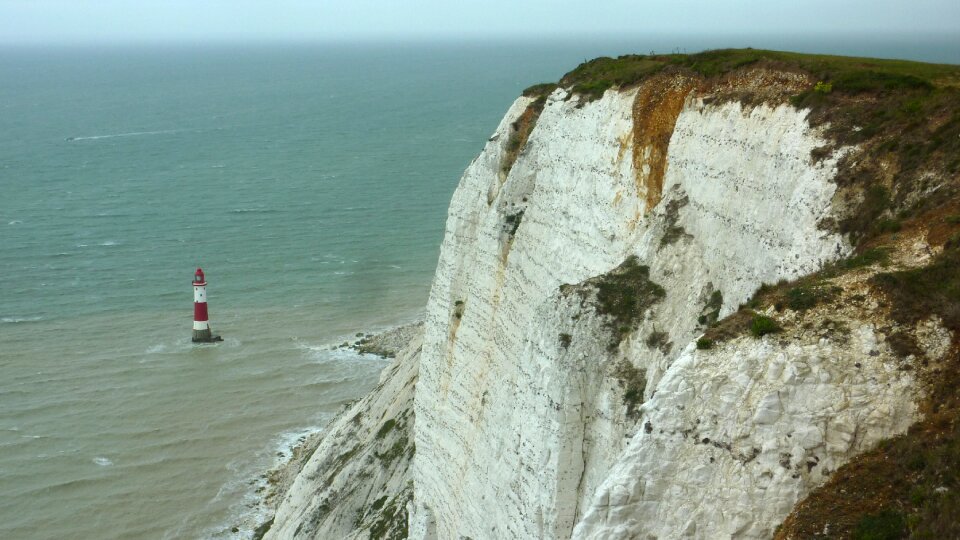 Lighthouse chalk cliffs england photo