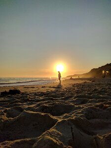 Sun silhouette beach sunset photo