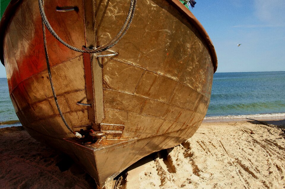 The coast beach a fishing vessel