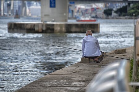 River fisherman fishing rod photo