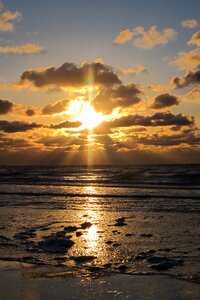 Beach sunset sun and clouds
