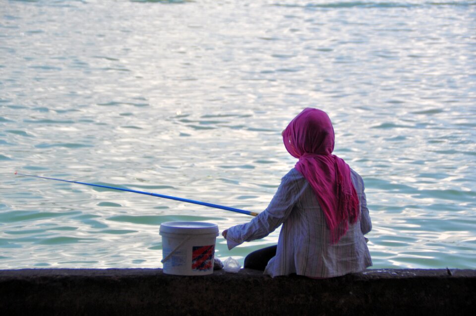 Fish fishing female