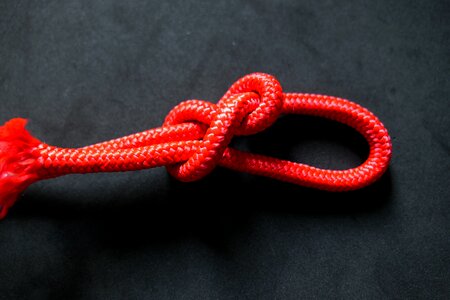 Red twisted ropes knotted photo