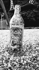 Glass bottle stones grey