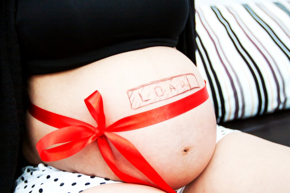 Beautiful pregnant mommy countdown a person