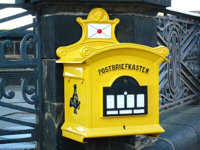 Old yellow post mail box photo