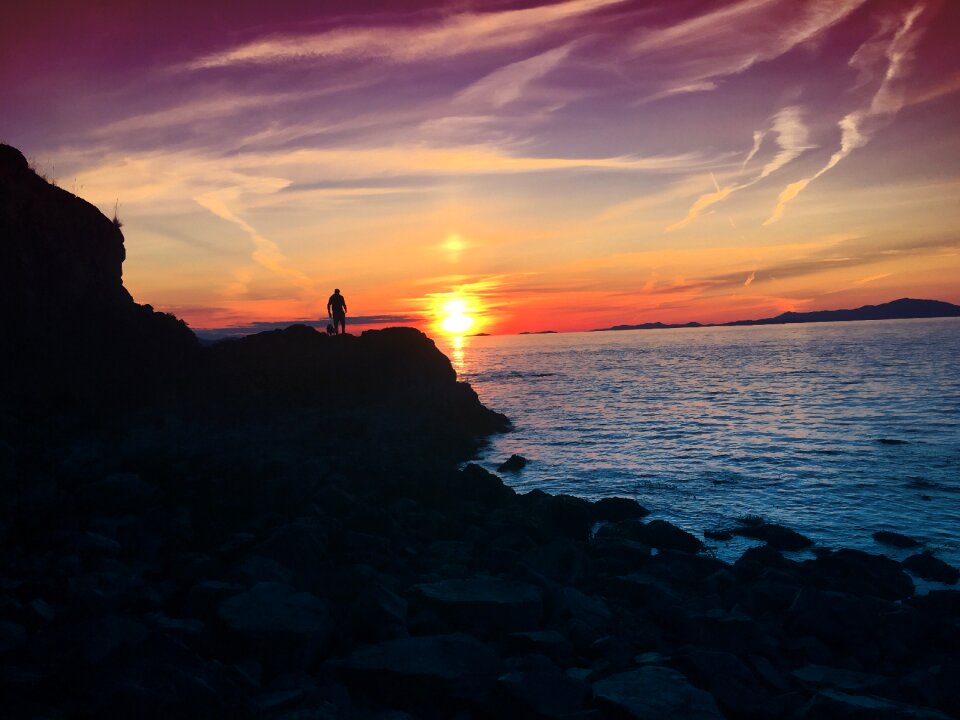 Purple sky ocean silhouette