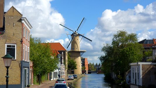 Wind mill mill blades cityscape