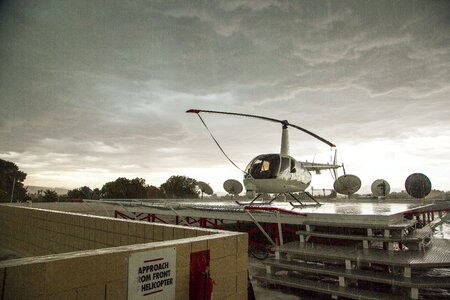 Stormy day on roof tv station helicopter in the rain photo