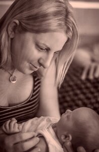 Girl newborn cradling photo