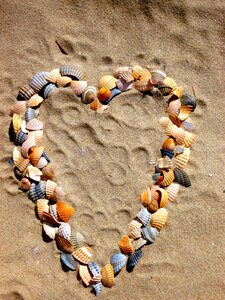 Sand heart shaped romantic photo