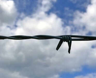 Sky cloudy barbed wire photo