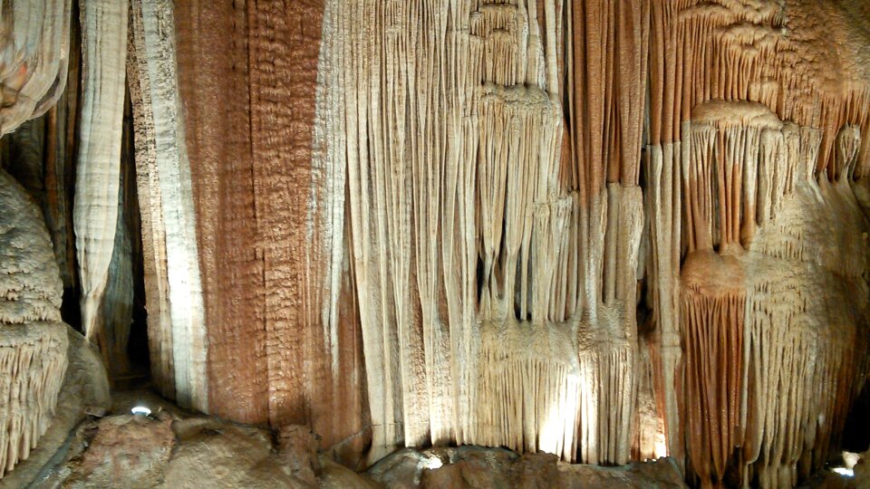 Dark deep stalagmite photo