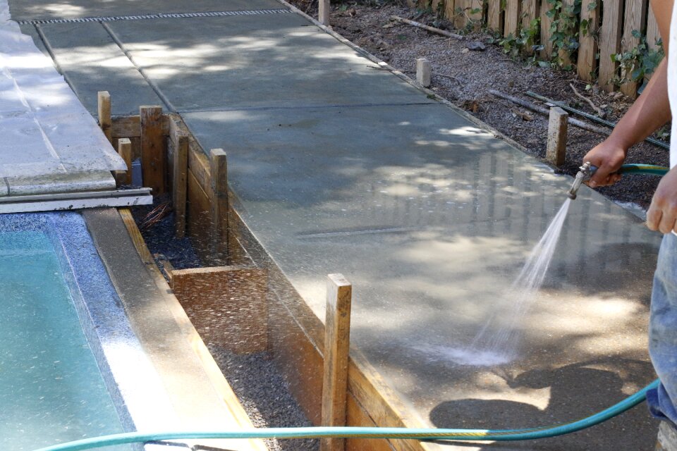 Concrete sidewalk pool swimming pool