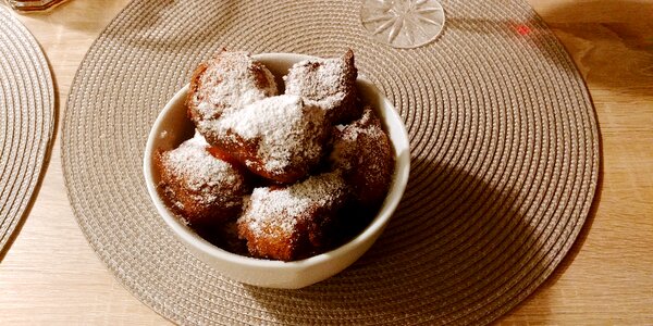 Powder frying little donuts photo