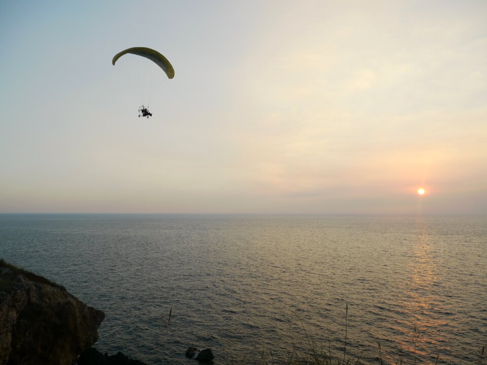 The evening sun sea paragliding