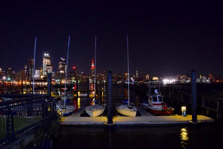 Sail boats dock skyline photo