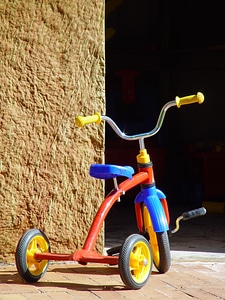 Red tricycle childs photo