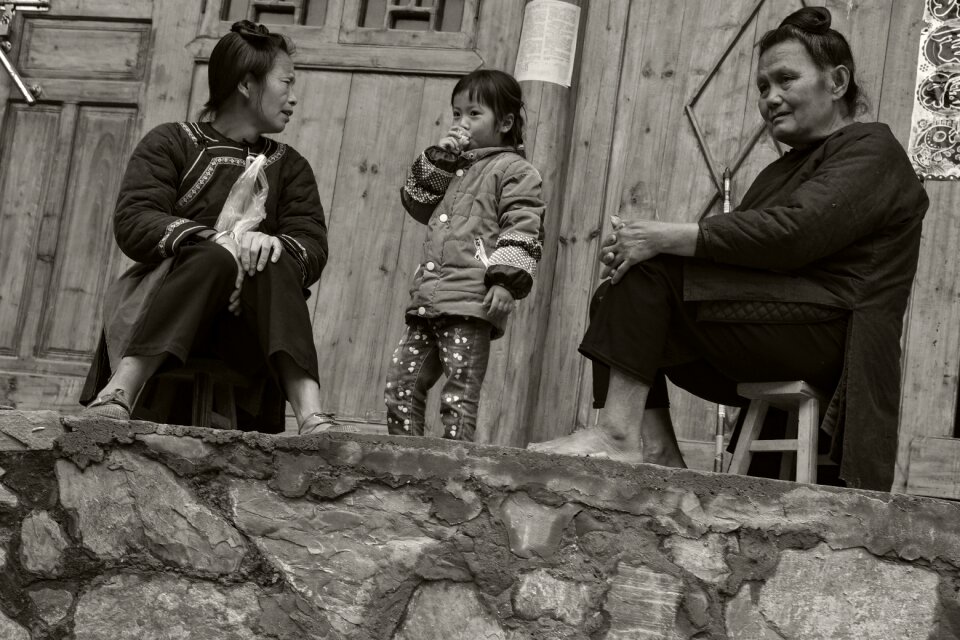 Group portrait the old woman kids