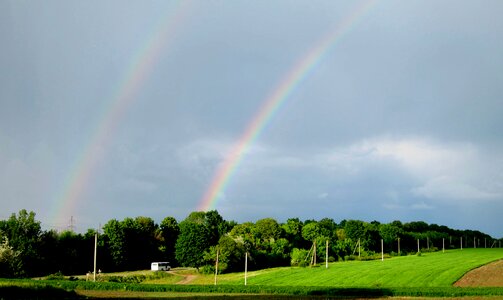 Road two rainbows sky