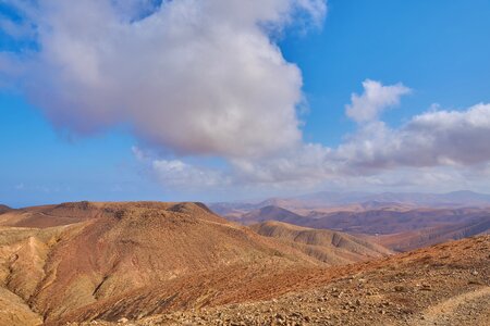 Blue sky desert hill photo
