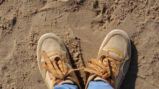 Shoe laces tracks beach photo
