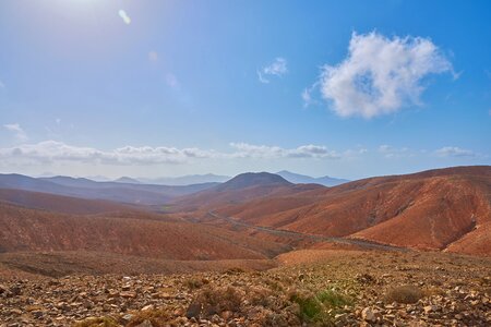 Blue sky desert hill photo