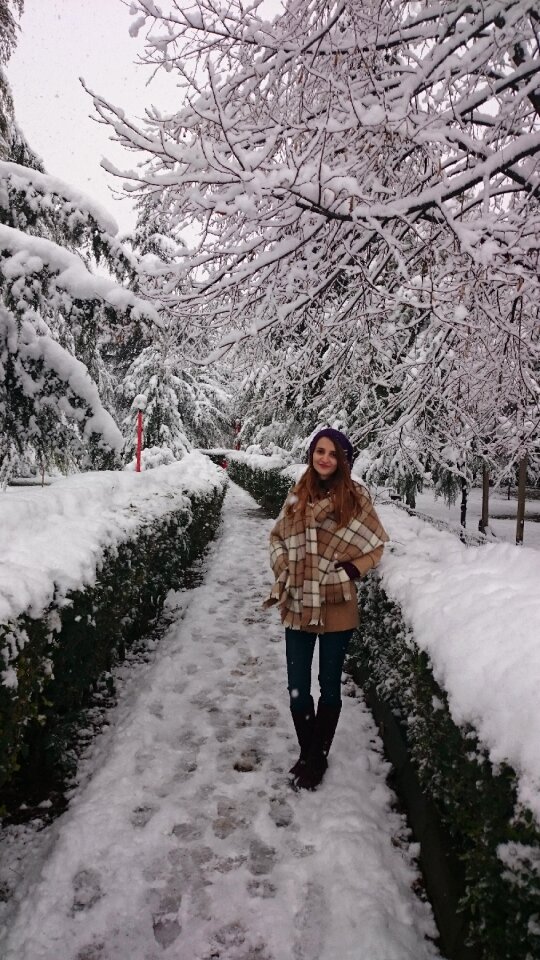 Posing girl snowy trees