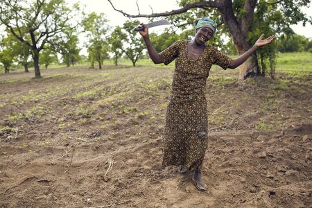 A woman on farm planting brown farmer
