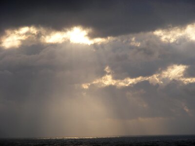 Horizon clouds rays of sunshine photo