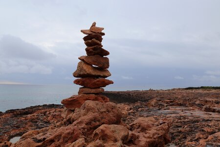 Meditation stone tower coast photo
