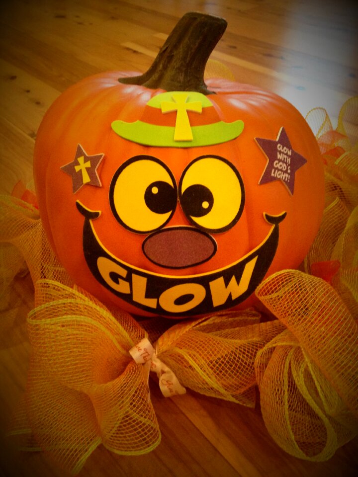 Jack-o-lantern christian pumpkin glow with god's light