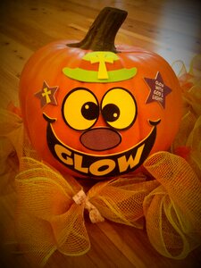 Jack-o-lantern christian pumpkin glow with god's light photo