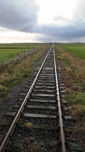 Railroad track clouds sky