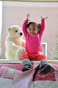 Kids playing teddy bear photo