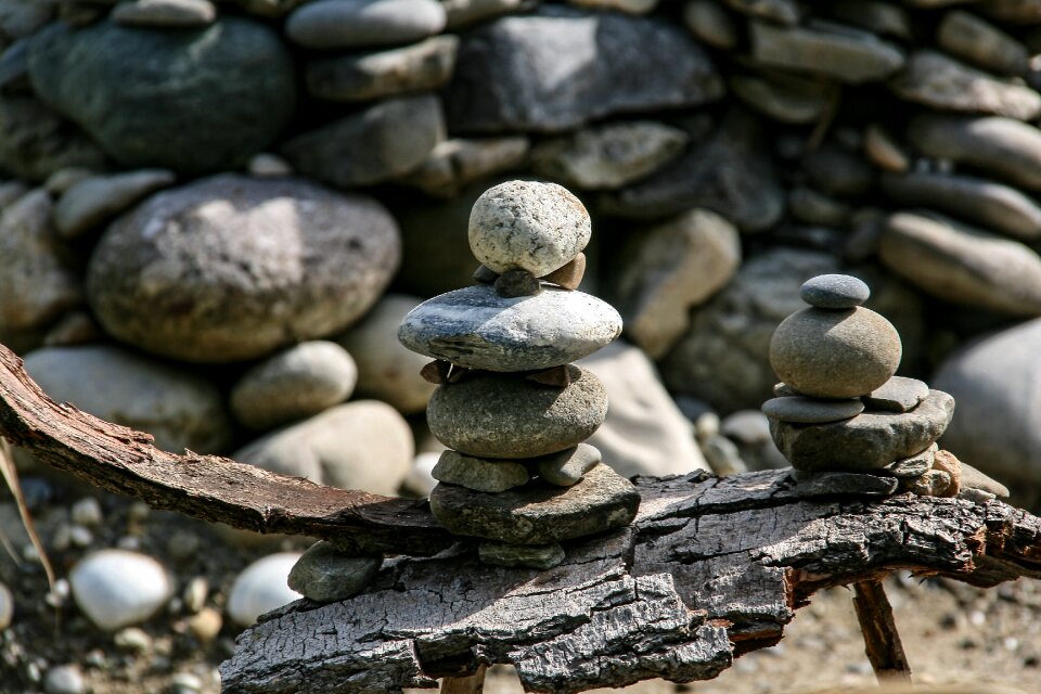 Stones balance tree bark