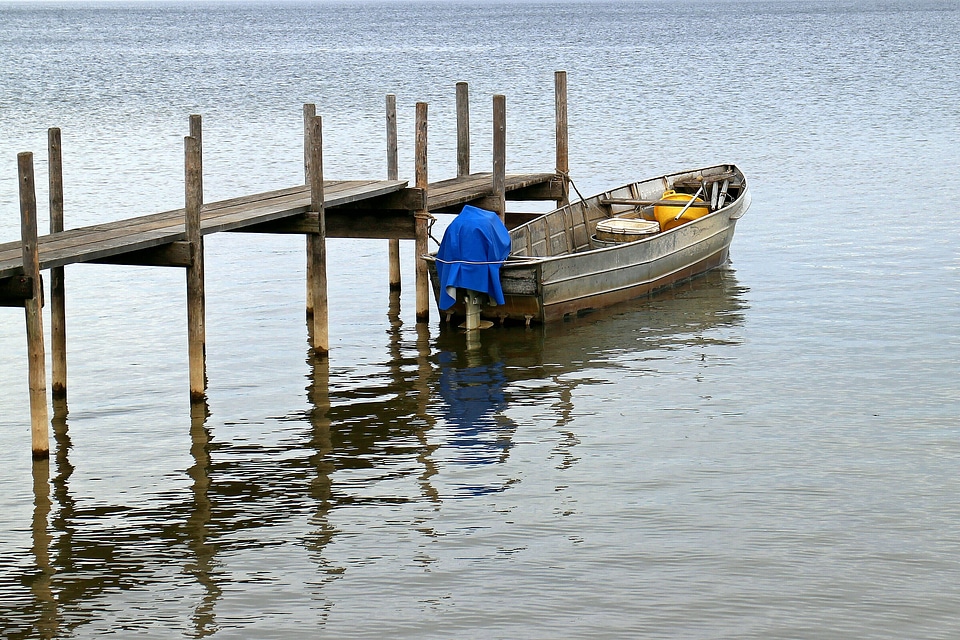 Fisherman fishing boat alone