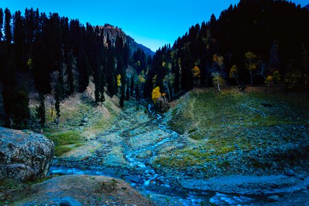 Autumn river through the mountains stream flowing photo